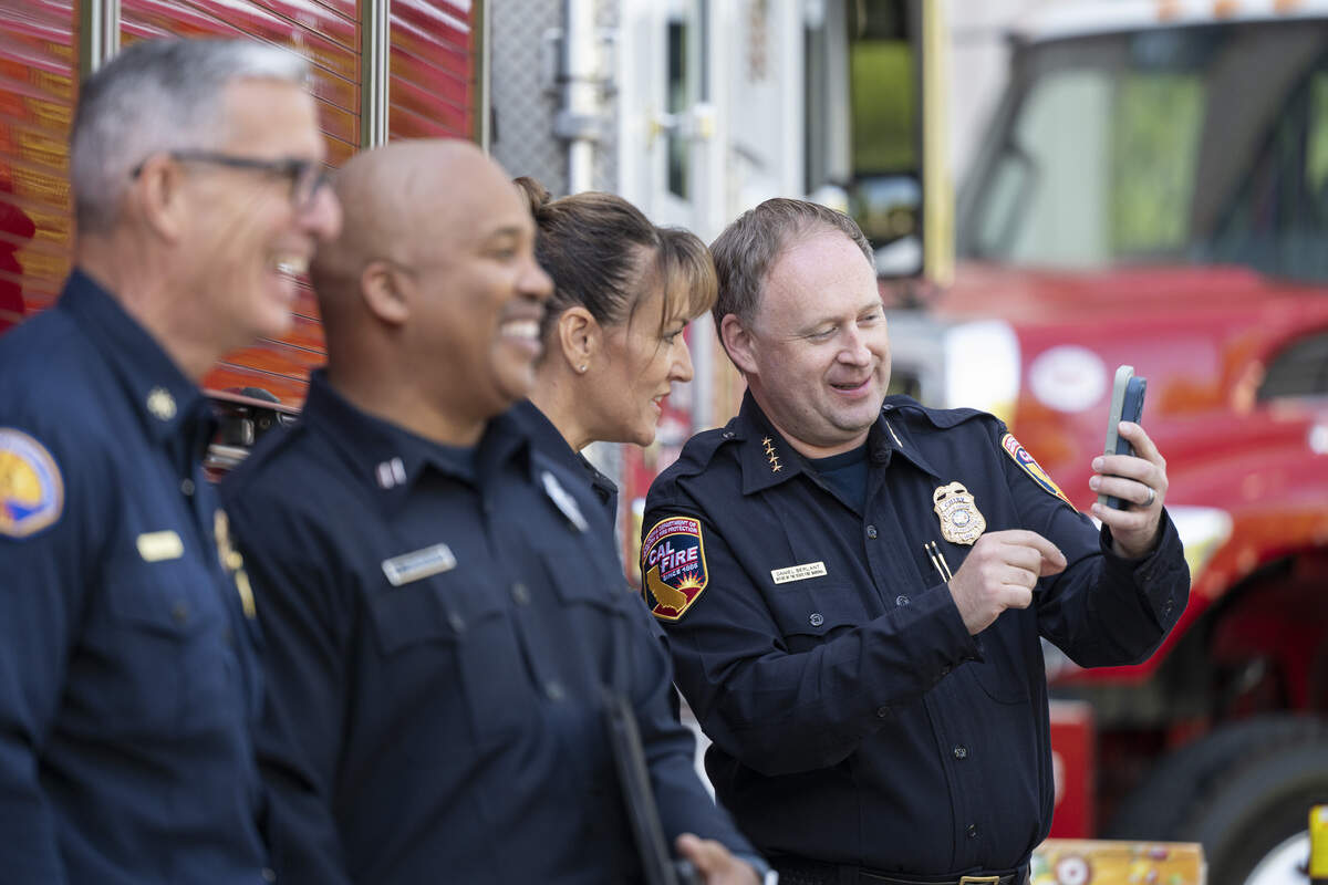State Fire Marshal Daniel Berlant, right, shows his phone to Amy Nygren, Sacramento Metro Fire’s fire marshal, before a Cal Fire press conference about fireworks safety at Shriners Children’s Northern California hospital in Sacramento on Thursday, June 25, 2026.